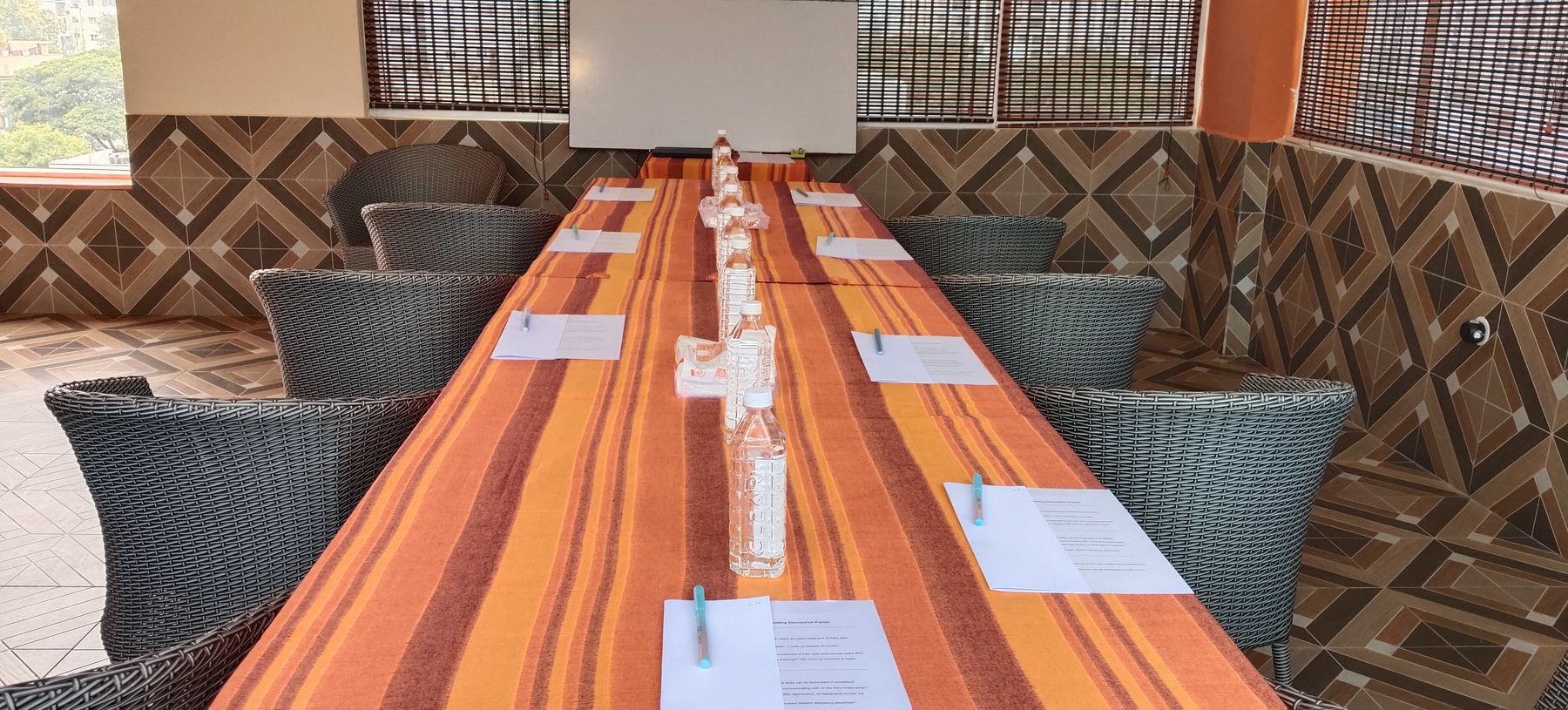 Long dining table set for a rooftop BBQ dinner