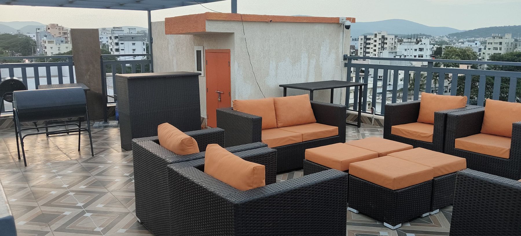 Rooftop lounge sofas with a city view