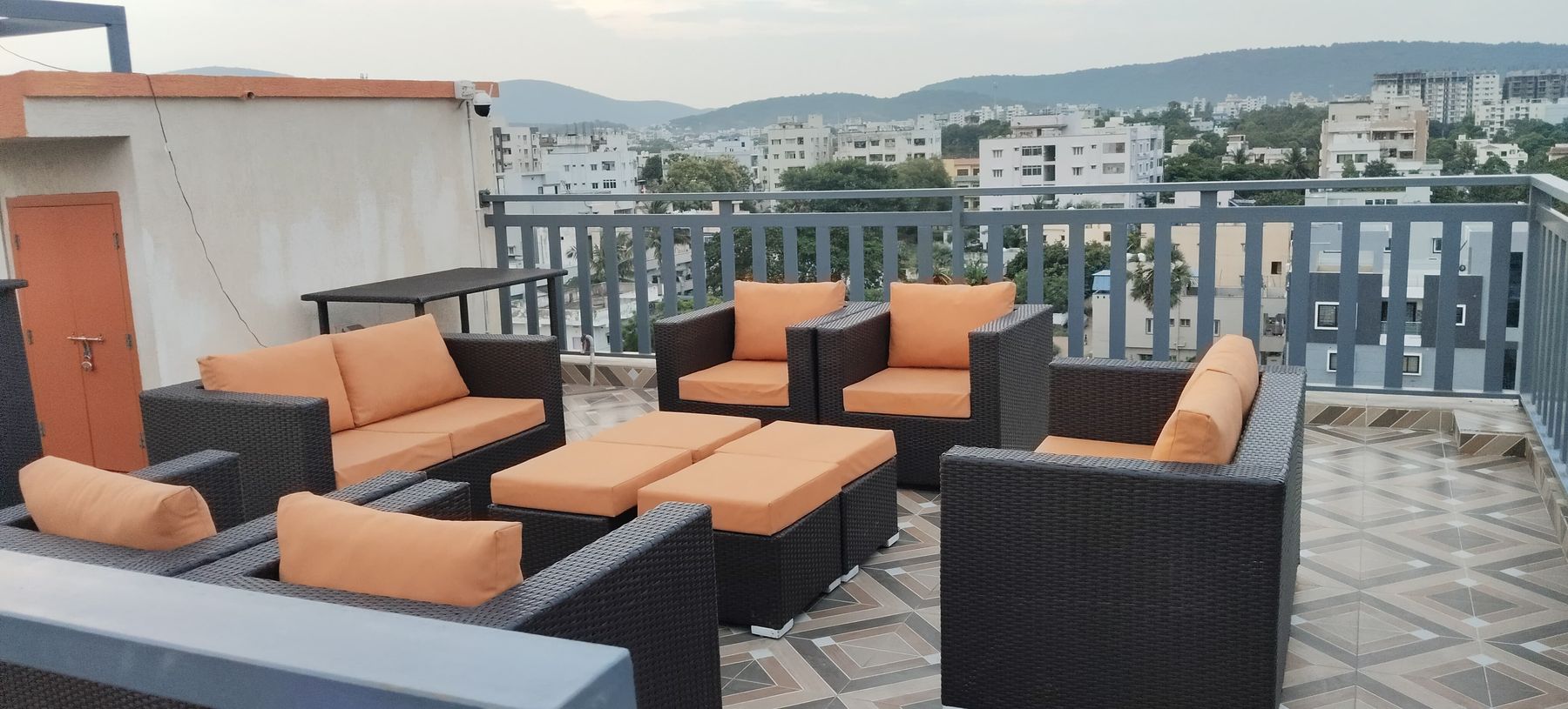 Rooftop lounge sofas with a wide city view