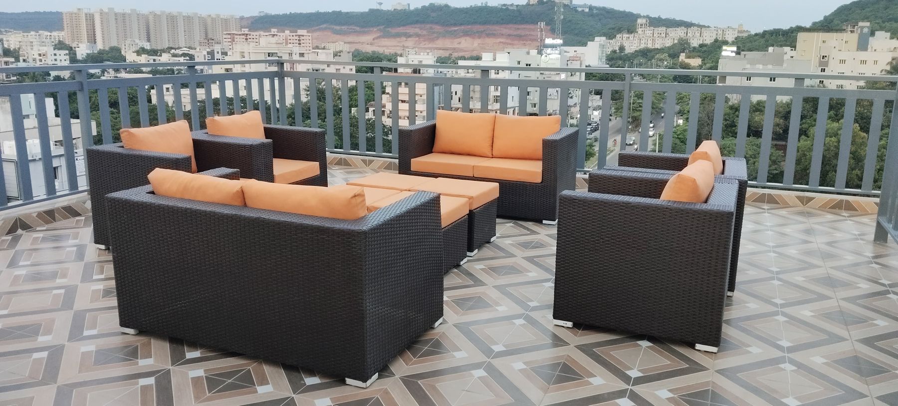 Rooftop BBQ option — sofas with a city view