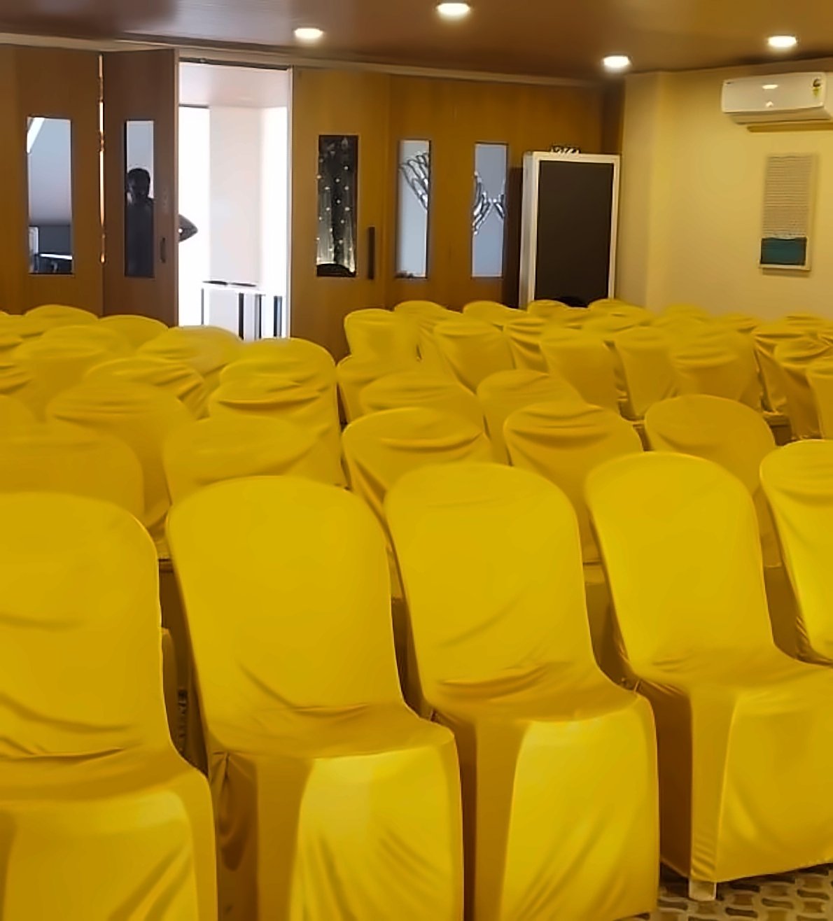 Rows of covered chairs in the function hall