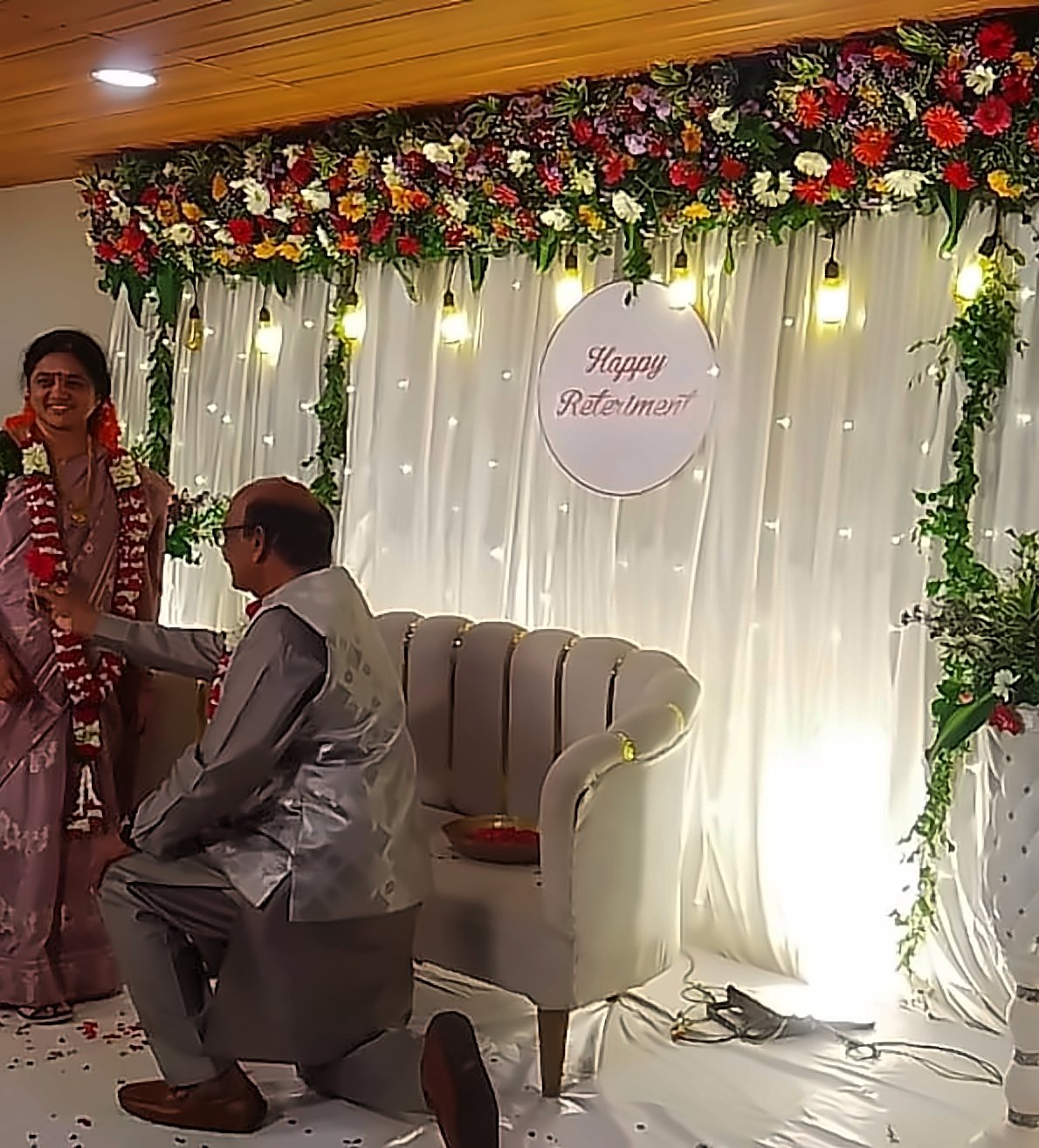 Couple celebrating a retirement function on stage